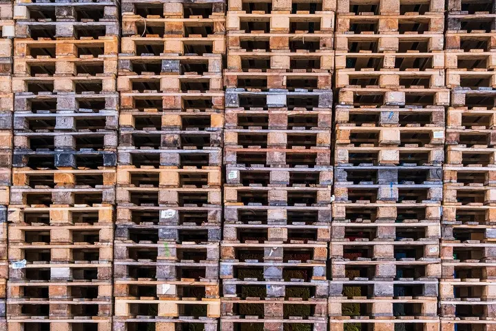 Stacks of used wooden pallets